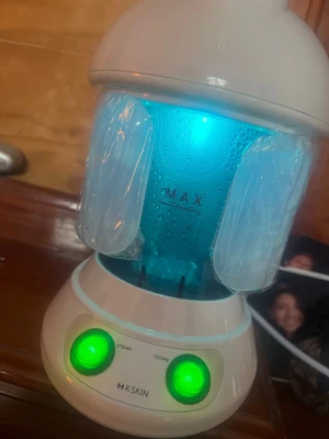 Customer photo of the facial steamer running with the tank lit up