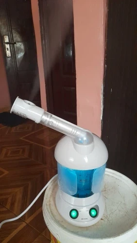 Customer photo of the steamer with its arm extended, filled with water